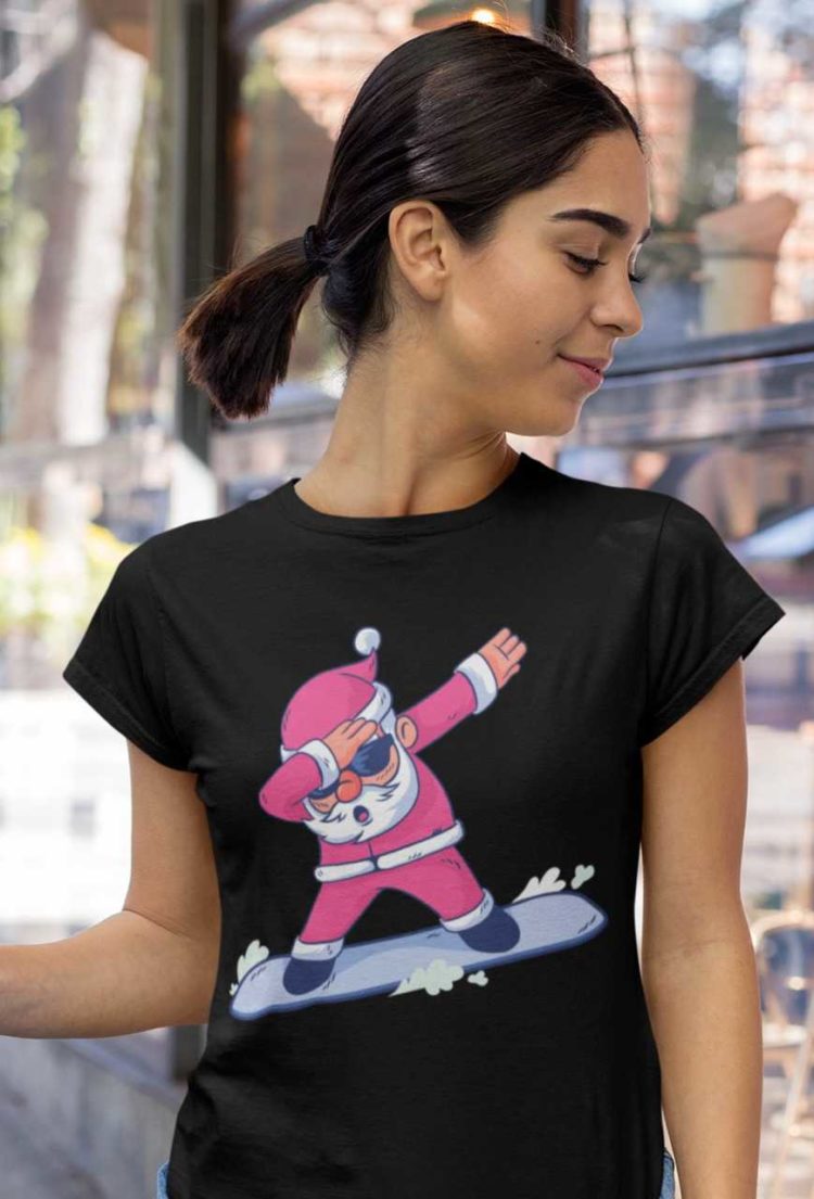 cool girl in a Black tshirt with Santa dabbing on a snowboard