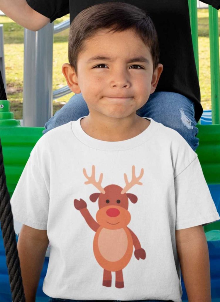 sweet boy in a white tshirt with a reindeer waving hello