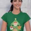 pretty girl in a green tshirt with a christmas tree with character ornaments