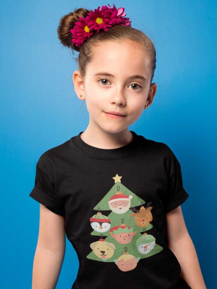sweet girl in a Black tshirt with a christmas tree with character ornaments