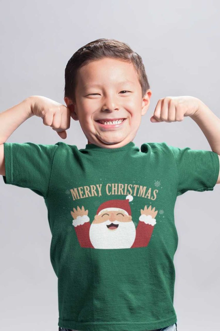 cute boy in Green tshirt with Santa saying Merry Christmas