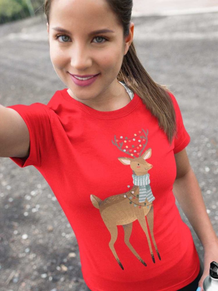 Lovely gierl ina red tshirt with a reindeer with christmas lights