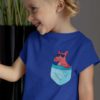 happy little girl in a Deep blue tshirt with a Kangaroo in the pocket