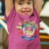 little girl playing in a Tropical tours Dark pink tshirt