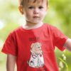 sweet little boy in a red DOGTOR Tshirt