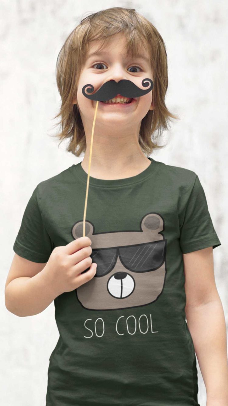 cheerful boy in an olivr green Tshirt with a bear wearing sunglasses