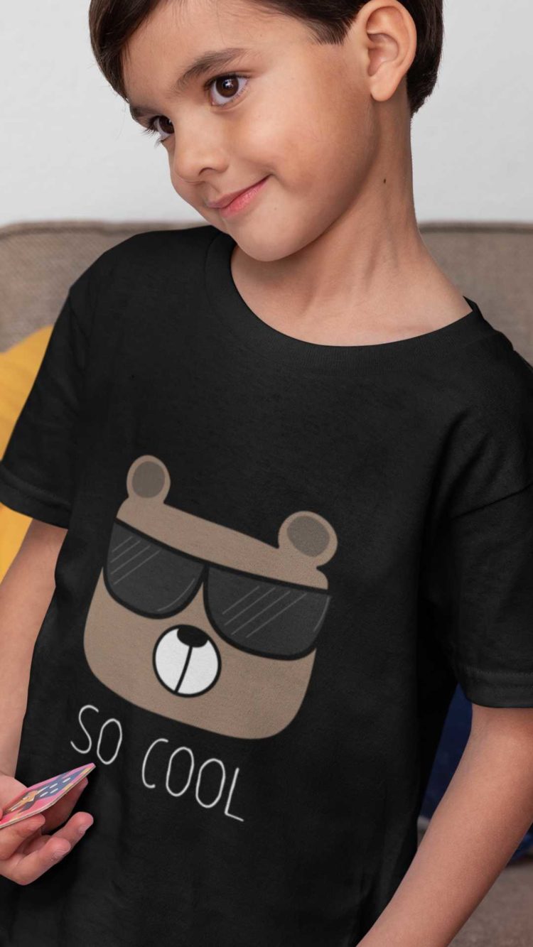 smart boy in a black Tshirt with a bear wearing sunglasses