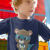little boy playing in a navy blue bear superhero tshirt