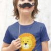 cheerful boy in a deep blue tshirt with a cute lion