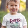 Adorable Boy In A Dino Racer White Tshirt
