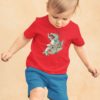 Adorable little boy playing in a red Tshirt with a Dinosaur doing Karate