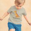 Adorable little boy in a grey tyrannosaurus tshirt