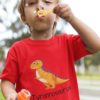 playful little boy in a red tyrannosaurus tshirt